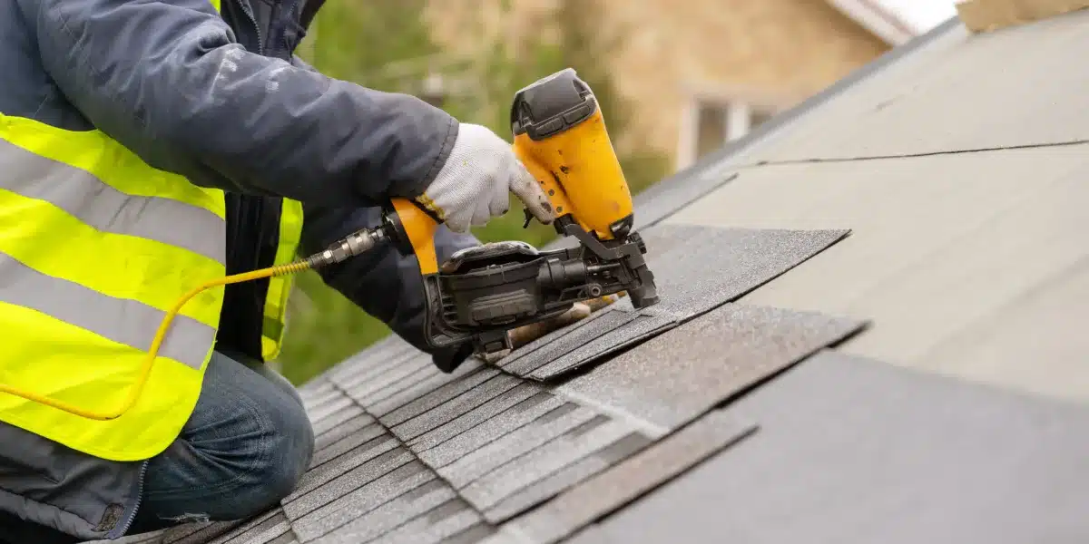 Roofer,Worker,In,Special,Protective,Work,Wear,And,Gloves,,Using