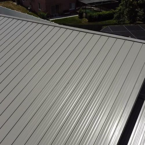 Closeup of grey metal roof from above