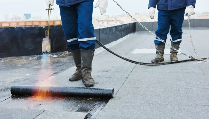 Flat,Roof,Installation.,Heating,And,Melting,Bitumen,Roofing,Felt